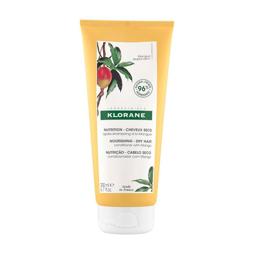 Gelbe Tube mit weißem Verschluss. Aufdruck: Mango-Abbildung, Klorane-Logo, Text für trockenes Haar. 96% natürliche Inhaltsstoffe.