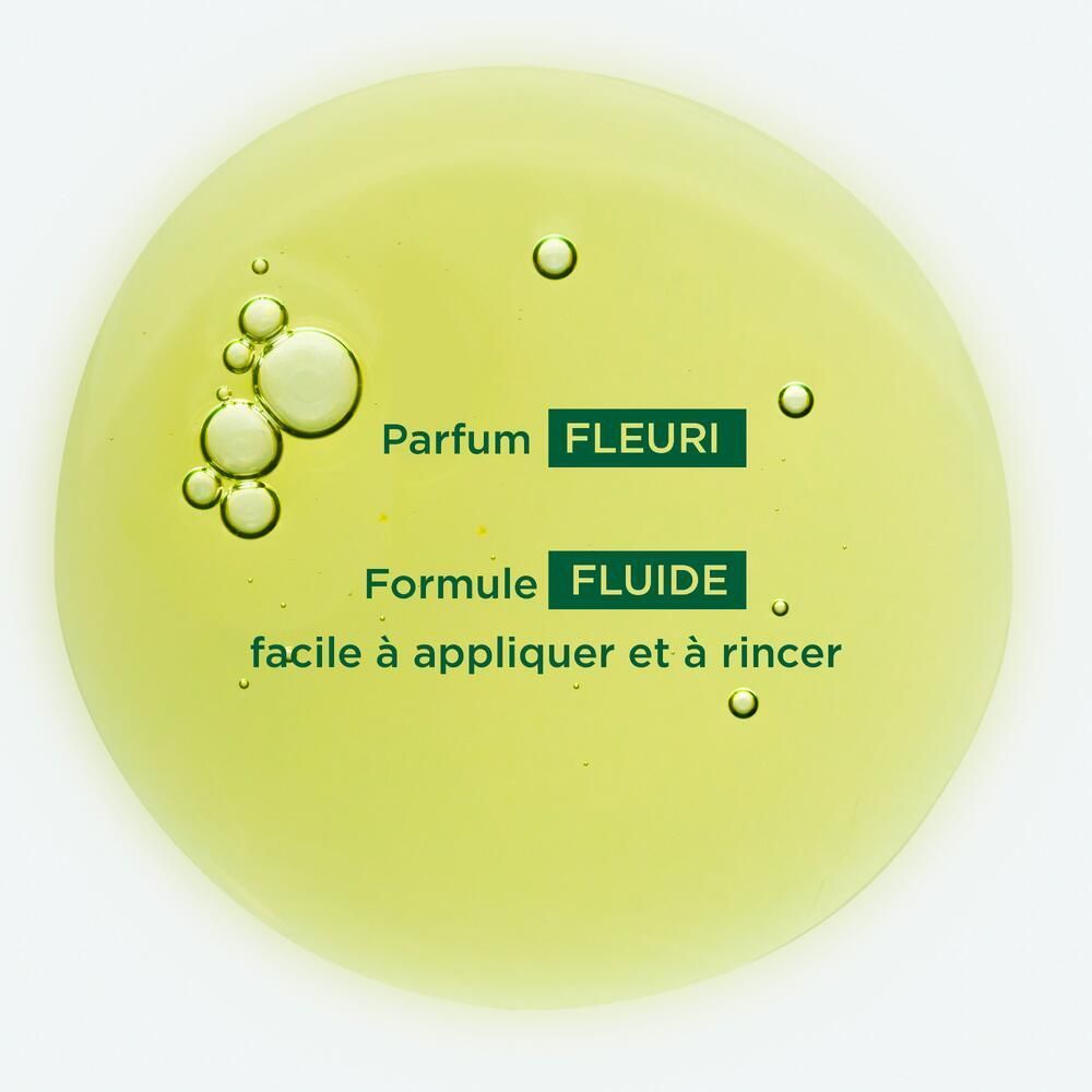 Liquide jaune avec bulles. Texte: Parfum Fleuri, Formule Fluide, facile à appliquer et à rincer (facile à appliquer et à rincer).
