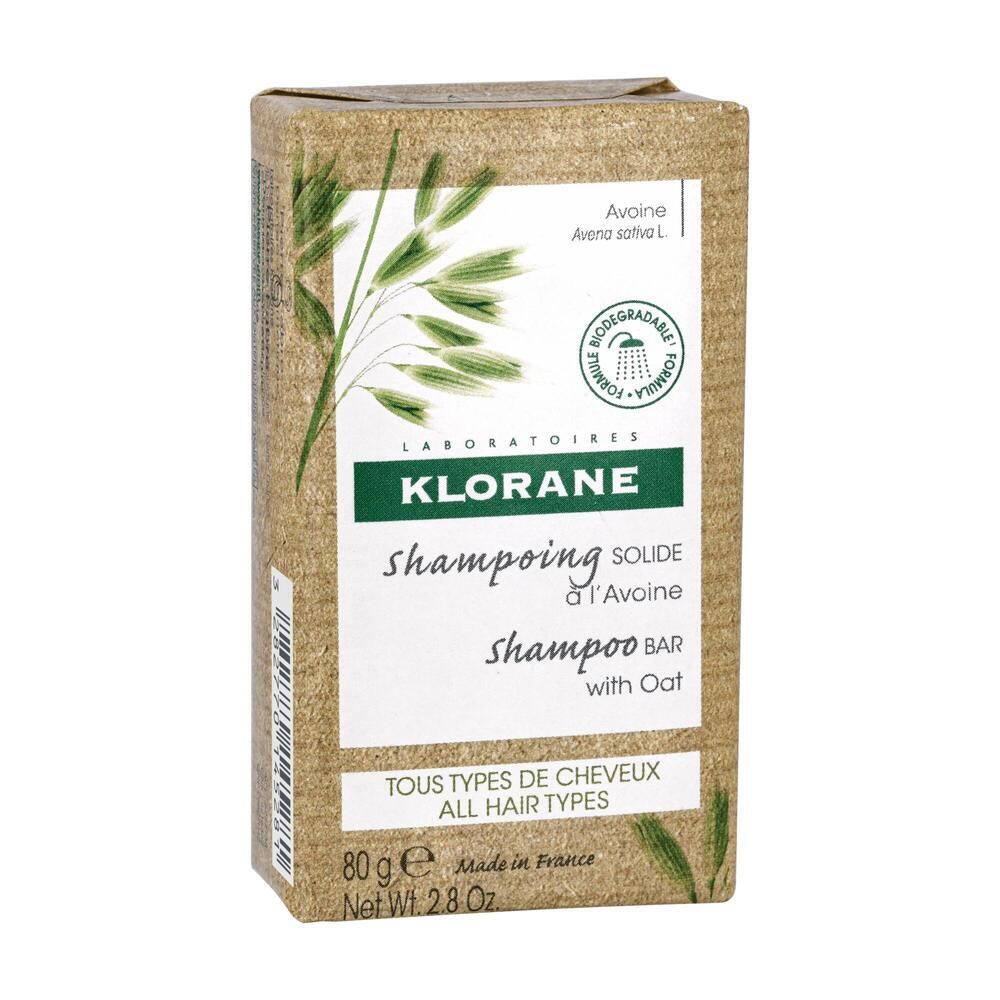 Kartonverpackung mit KLORANE-Shampoo-Bar mit Hafer. Enthält 80g. Mit Aufdruck: Tous types de cheveux.