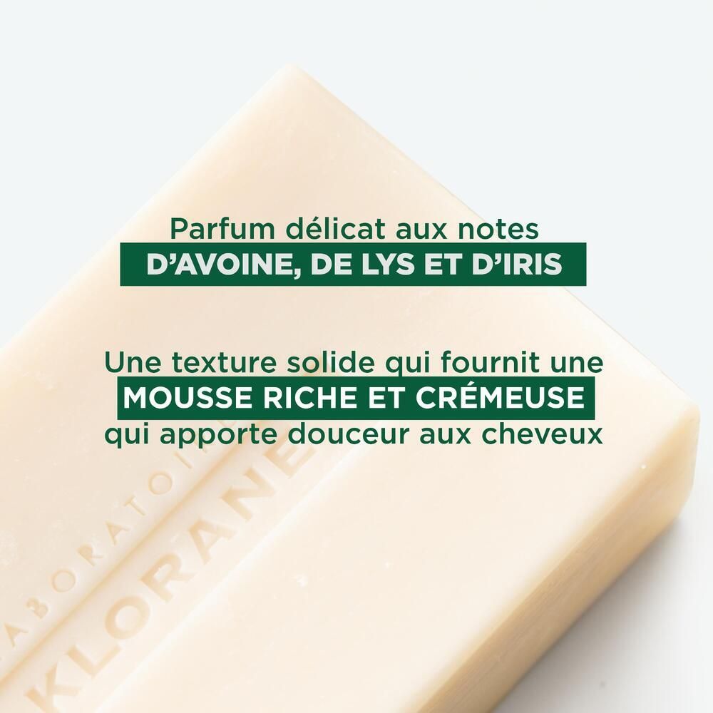 Nahaufnahme der Seife. Text: 'Parfum délicat aux notes d'avoine, de lys et d'iris'.