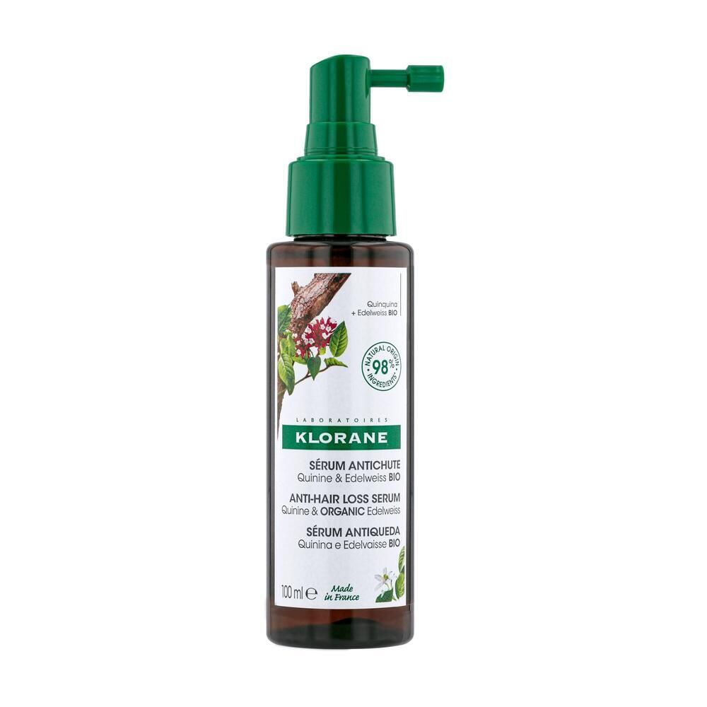 Braune Flasche mit grünem Pumpkopf. Aufschrift: KLORANE, Anti-Haarausfall Serum. Mit Chinin & Edelweiss Bio. 100ml.