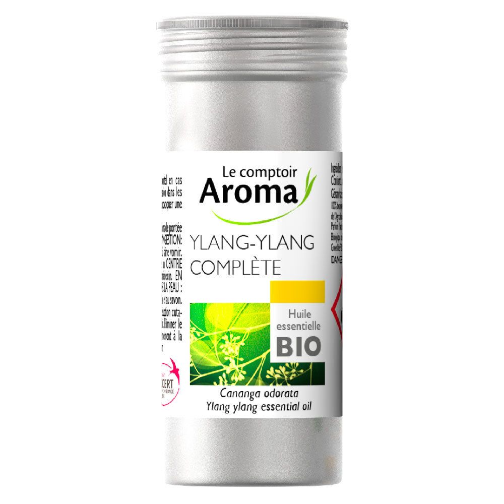 Emballage cylindrique en métal avec bouchon à vis. Étiquette avec nom du produit et label bio. Huile Ylang-Ylang.