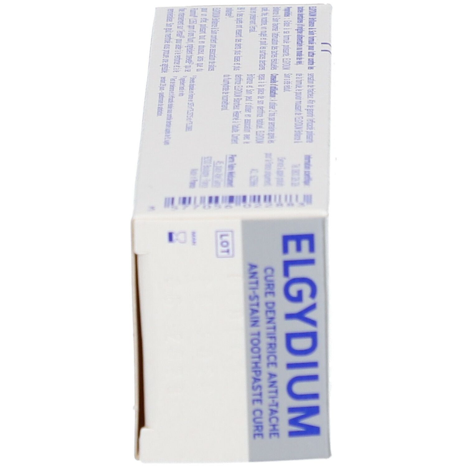Boîte, vue latérale. ELGYDIUM, Cure Dentifrice Anti-Tache. Texte et logos.