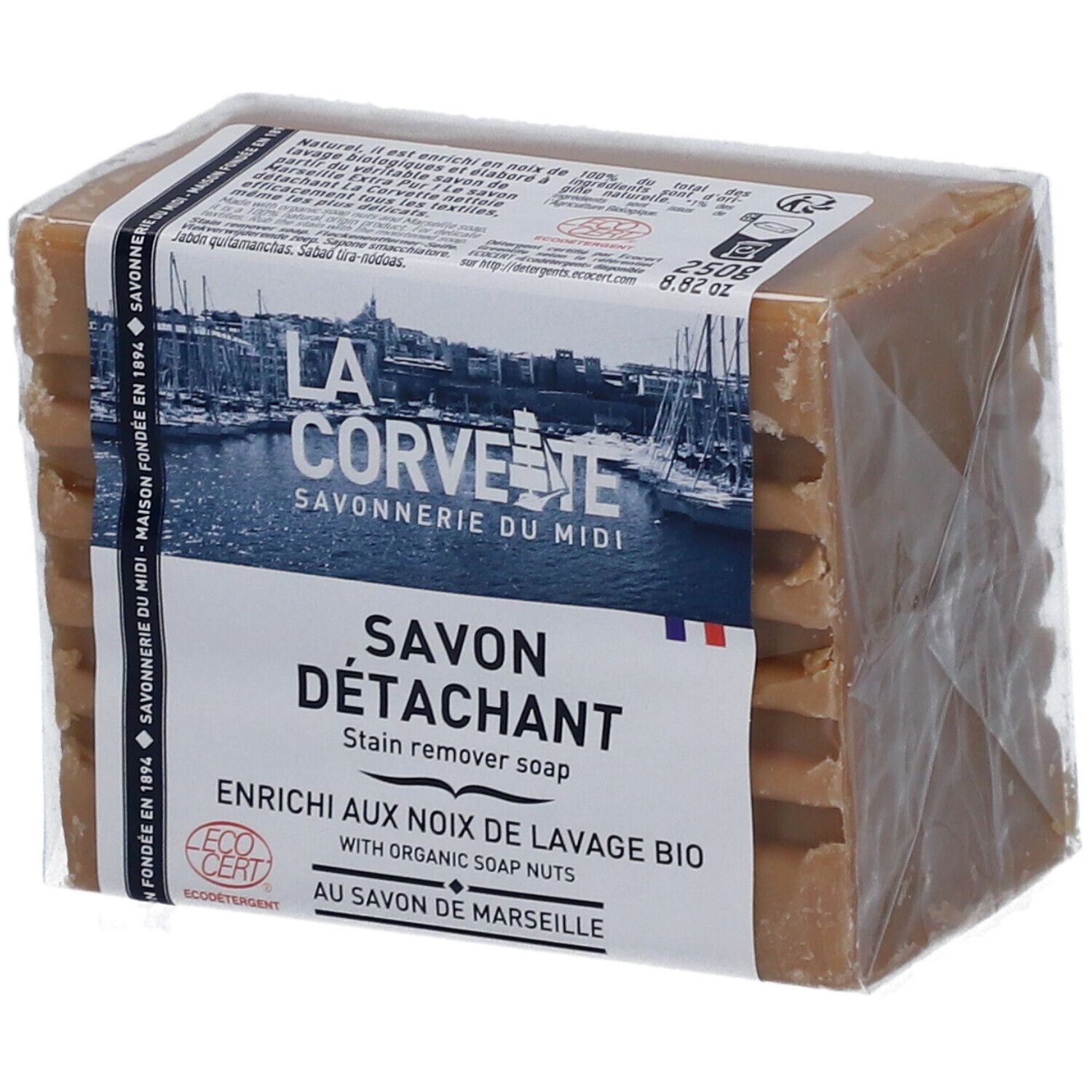 Savon détachant emballé. L'emballage porte les mentions "LA CORVETTE Savonnerie du Midi" et "Savon Détachant".