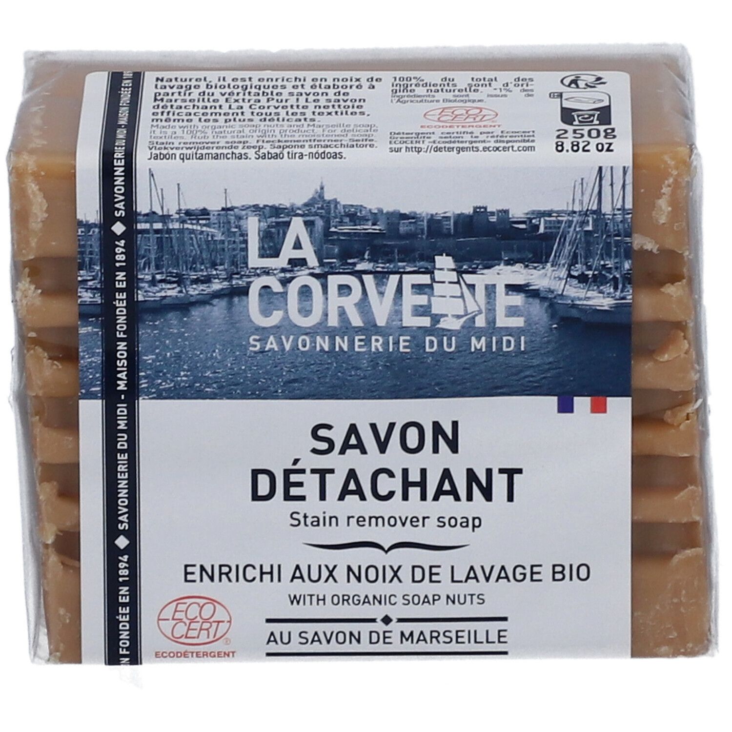 Savon détachant emballé. L'emballage porte les mentions "LA CORVETTE Savonnerie du Midi" et "Savon Détachant".