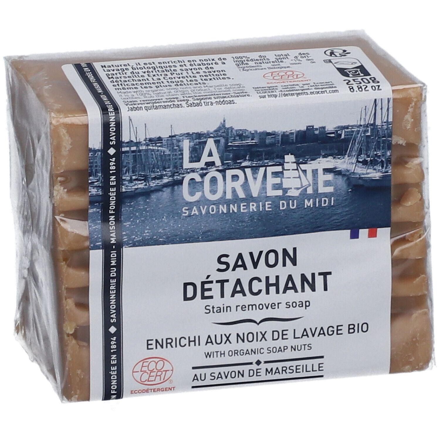 Savon détachant emballé. L'emballage porte les mentions "LA CORVETTE Savonnerie du Midi" et "Savon Détachant".