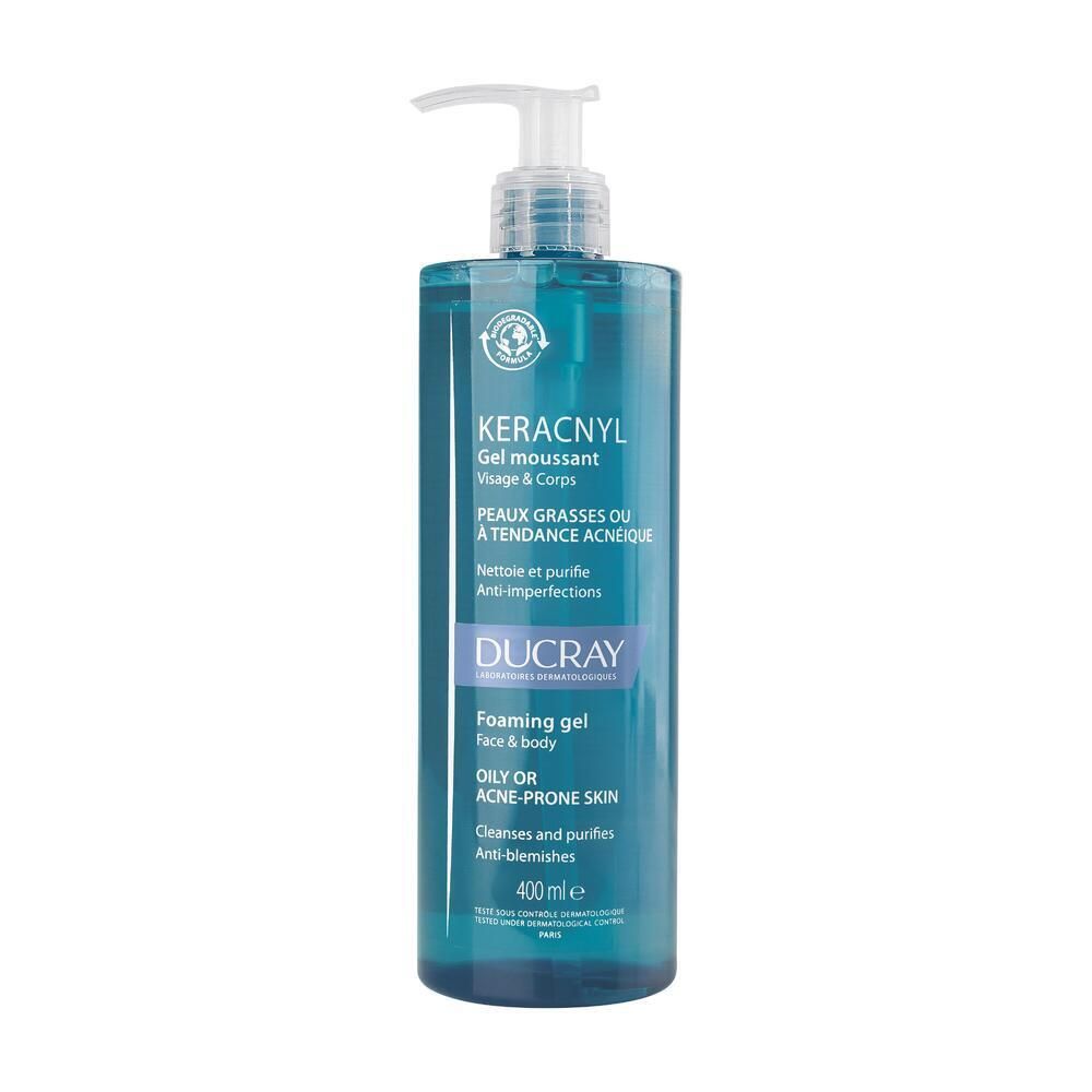 Flacon bleu transparent avec pompe. Inscription : KERACNYL, Gel moussant, pour peaux grasses. Marque DUCRAY.