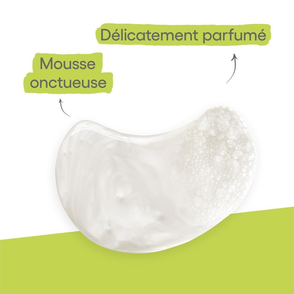 Nahaufnahme von Duschgel. Text: Mousse onctueuse, Délicatement parfumé. Gel-Textur mit Schaum.