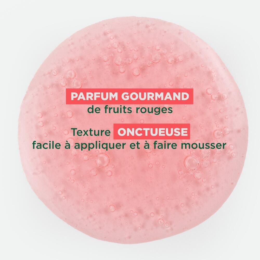 Gros plan d'une substance gélifiée rose. Texte: PARFUM GOURMAND, Texture ONCTUEUSE.