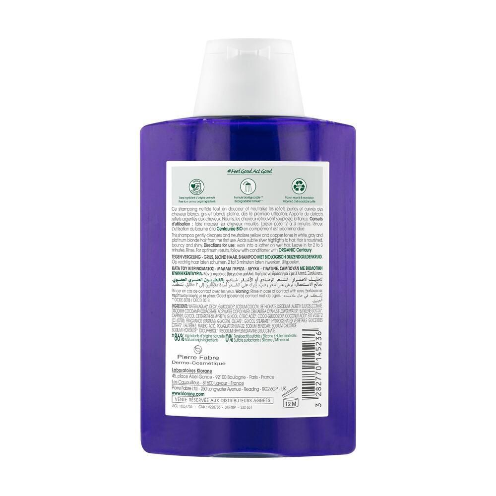 Rückseite einer blauen Shampoo-Flasche. Text: Produktinformationen, Inhaltsstoffe, Herstelleradresse, Recycling-Symbol. 12M-Symbol.