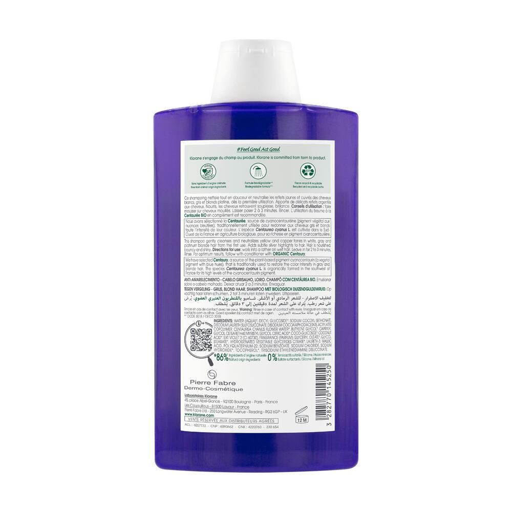 Rückseite der violetten Shampoo-Flasche. Text mit Inhaltsstoffen, Anwendungshinweisen und Recycling-Symbolen. QR-Code und Herstellerinformationen.