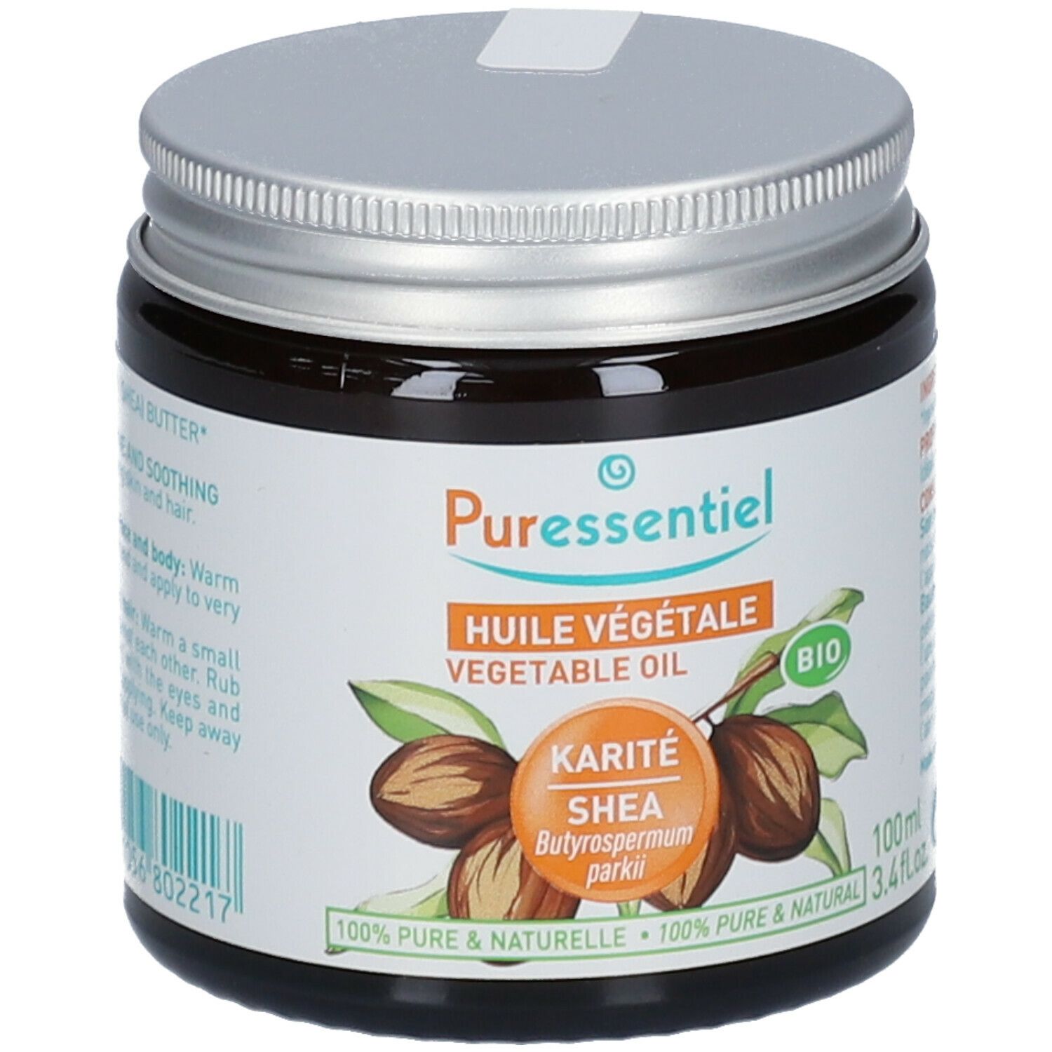 Pot en verre brun avec couvercle argenté. Inscription : Puressentiel, Huile Végétale, Karité Shea, Bio. 100ml.