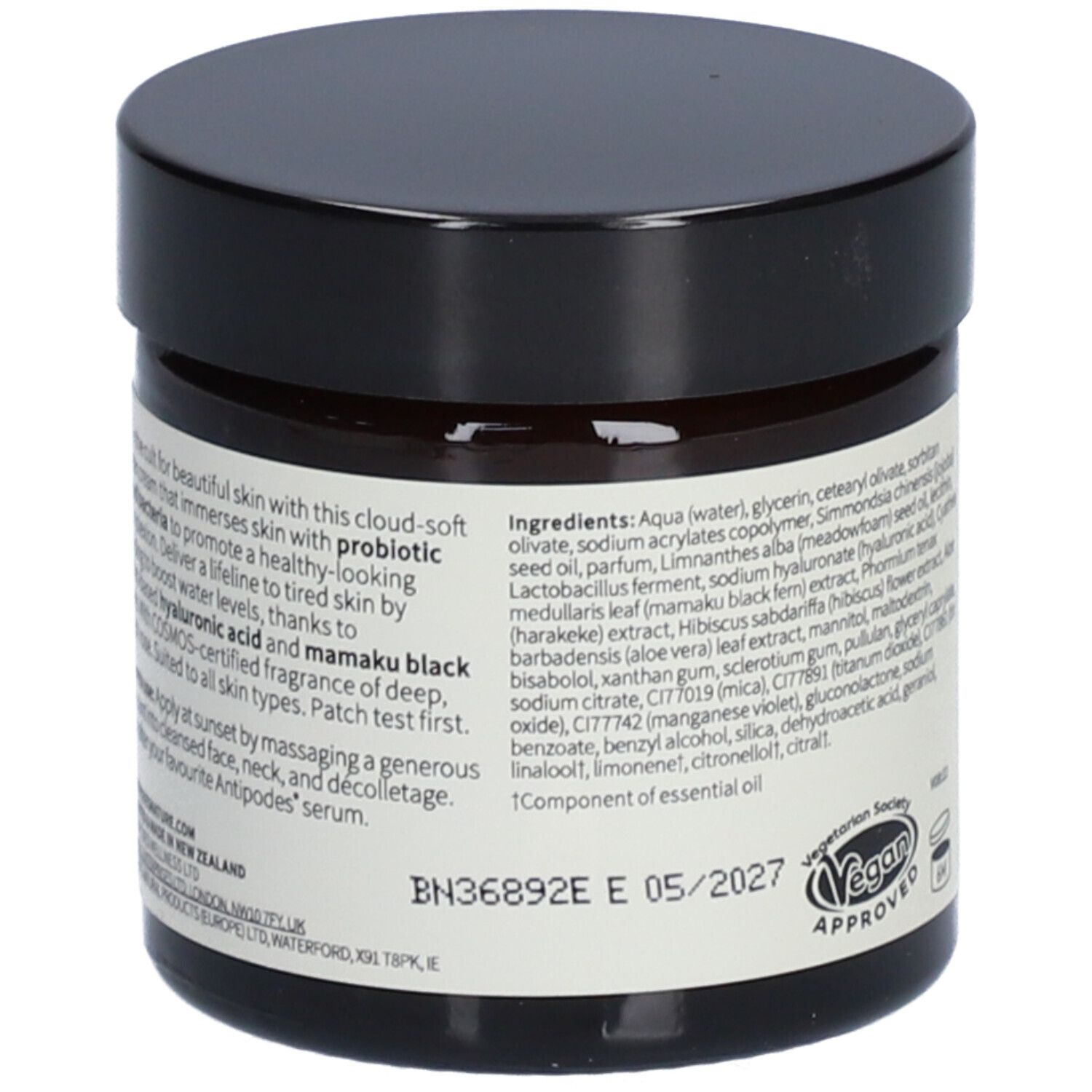 Pot foncé, couvercle noir. Dos: texte, ingrédients, label végétalien et date de péremption.