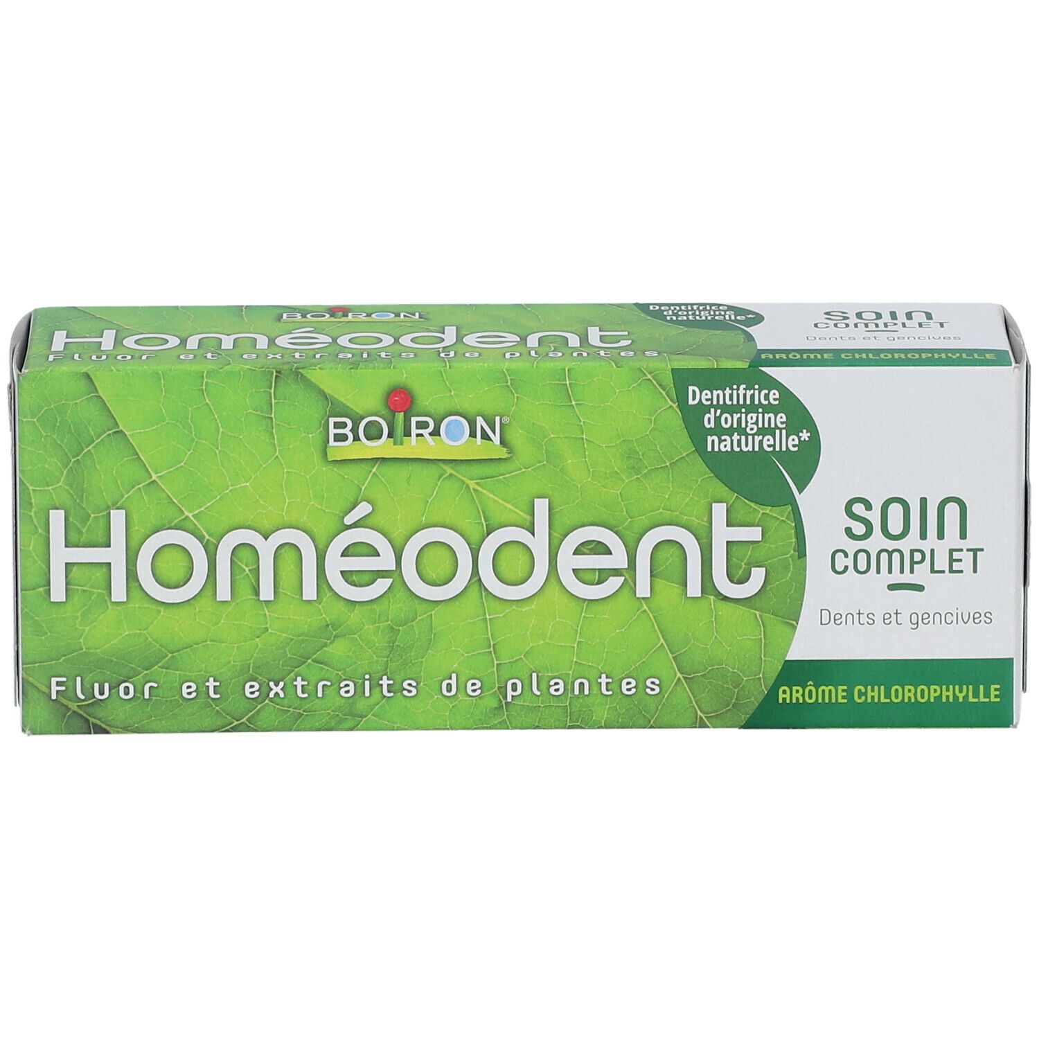 Boîte verte "Homéodent". Contient fluor et extraits de plantes. "Soin Complet" et "Arôme Chlorophylle" sont également visibles.