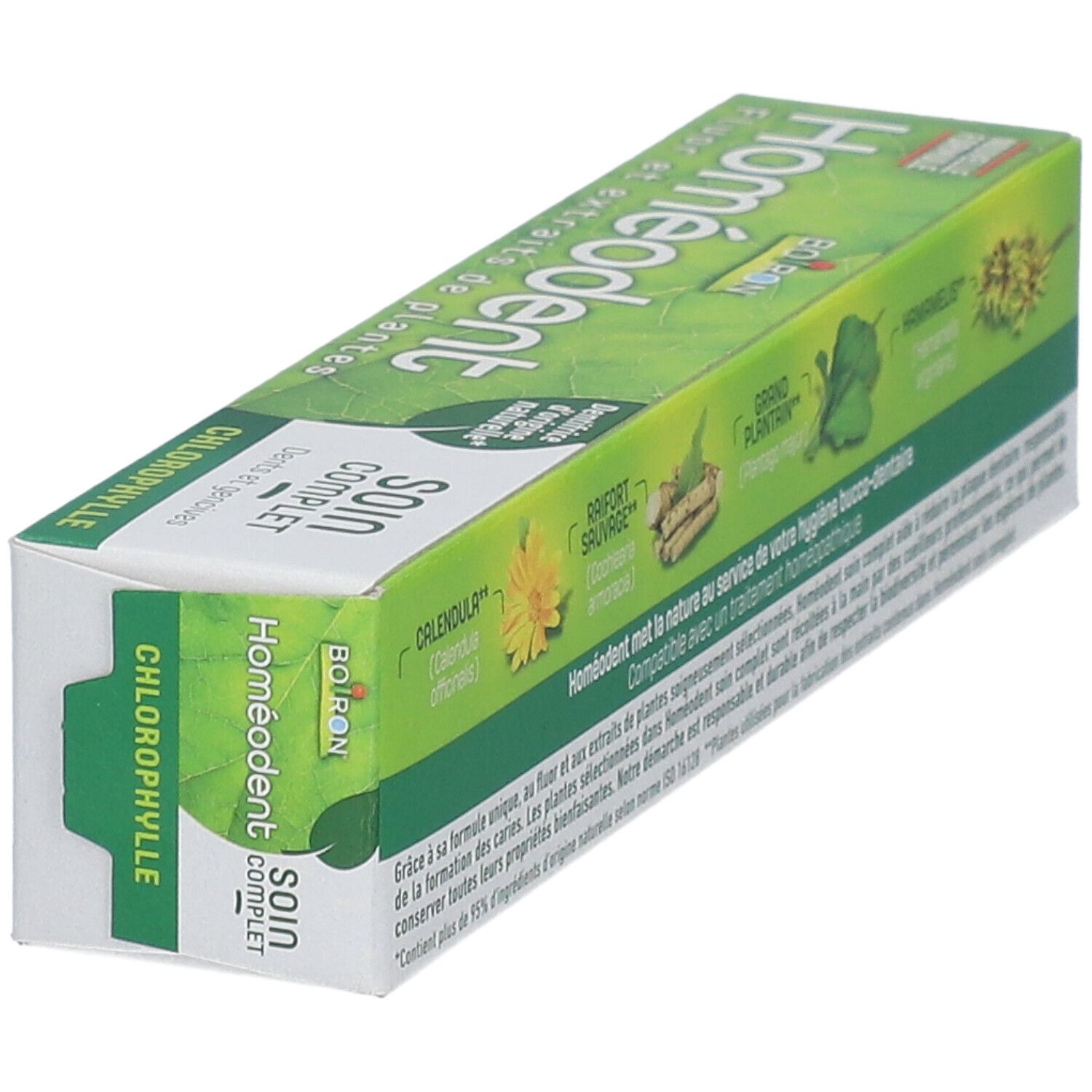 Emballage vert avec nom du produit et texte. Contient des extraits de plantes. Des illustrations de plantes et "Soin Complet" sont également visibles.
