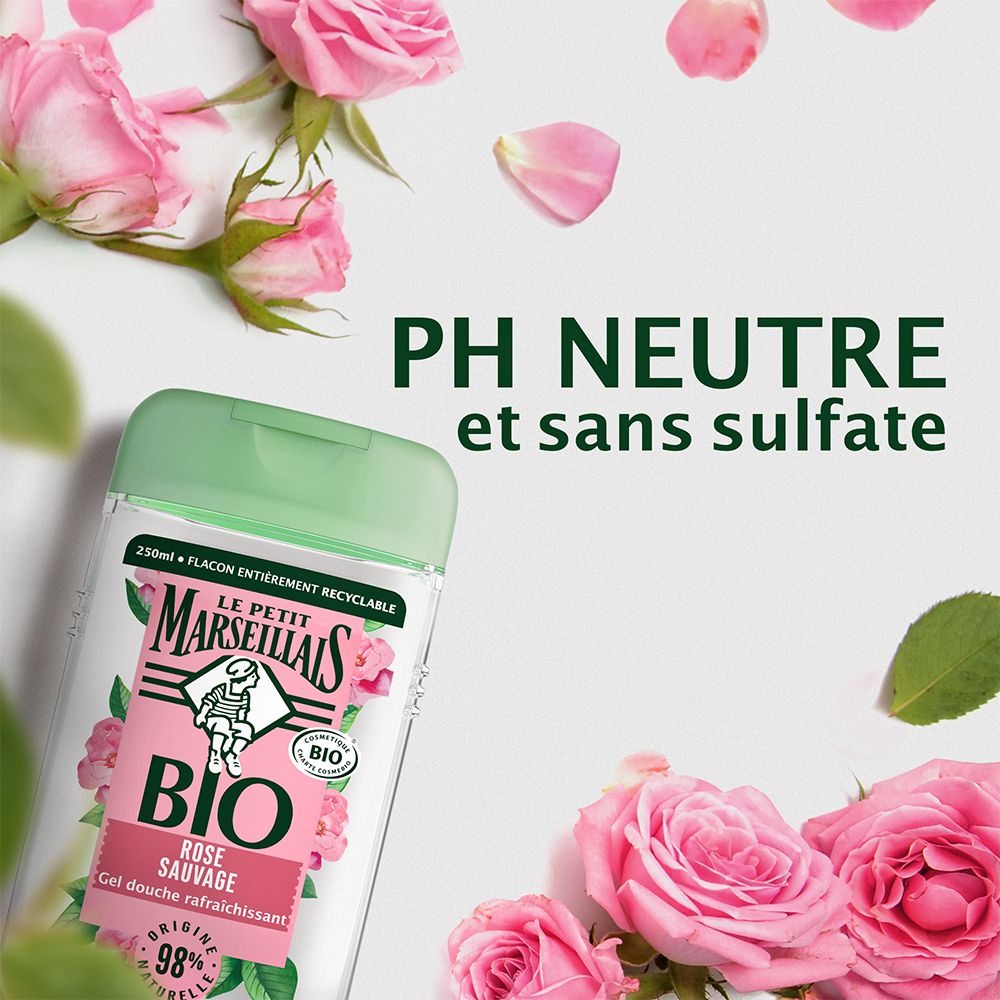 Flacon de gel douche avec roses et pétales. Inscription : BIO, Rose sauvage, 98% naturel. pH neutre.