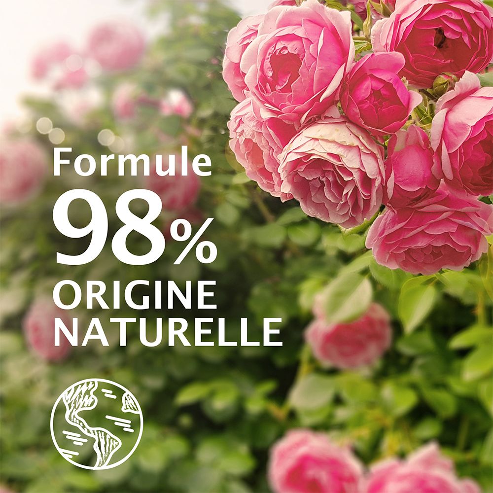 Flacon de gel douche avec roses. Inscription : BIO, Rose sauvage, 98% naturel. Origine naturelle.