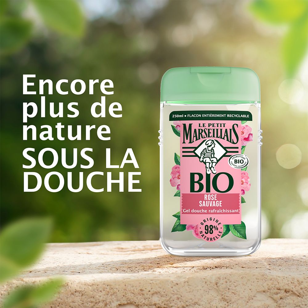 Flacon de gel douche. Inscription : BIO, Rose sauvage, 98% naturel. Plus de nature sous la douche.