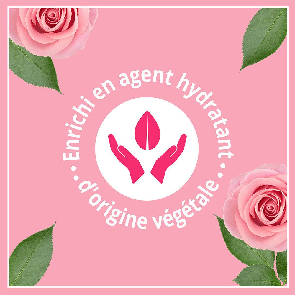 Fond rose avec des roses. Texte : Enrichi en agent hydratant d'origine végétale. Symbole mains.