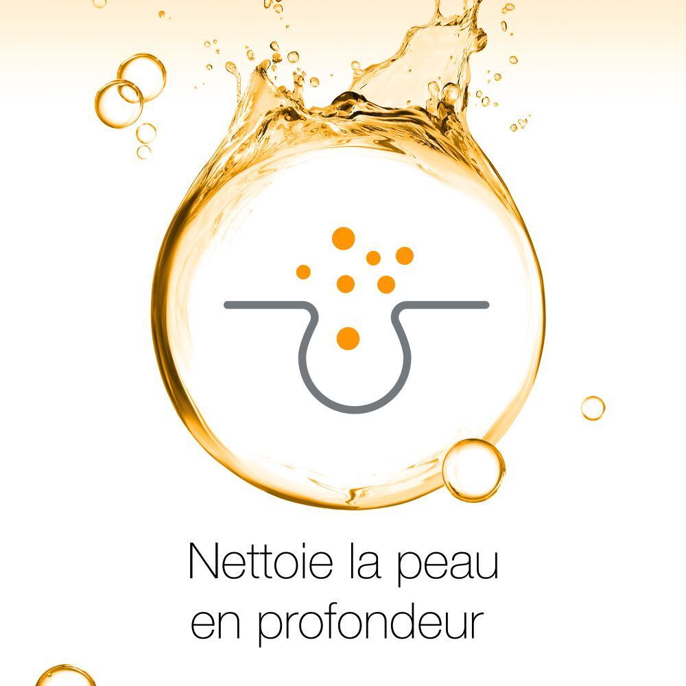 Icône d'un pore cutané avec des points dans un cercle doré. Texte: Nettoie la peau en profondeur.