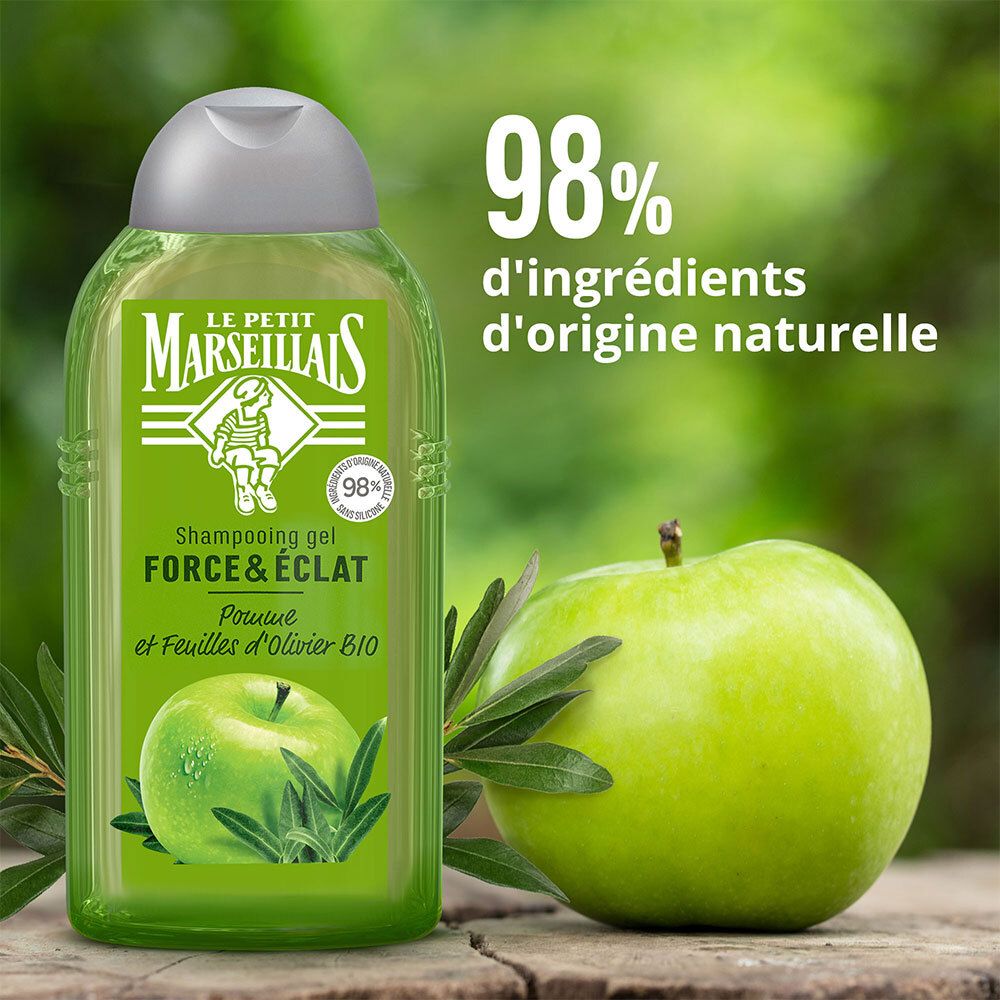 Flacon de shampoing avec pomme et feuille d'olivier. Texte: 98% d'ingrédients d'origine naturelle.