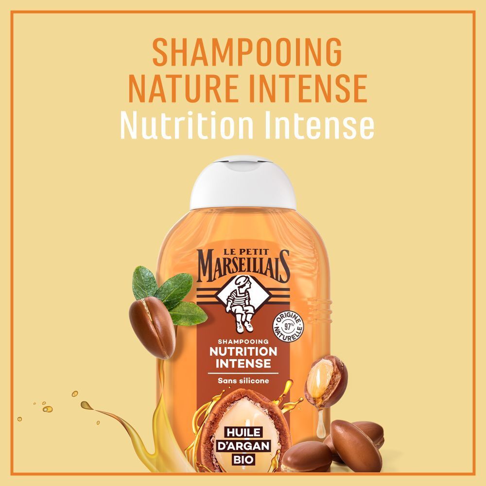 Flacon de shampooing avec noix d'argan et feuilles. Texte: Shampooing Nature Intense, Nutrition Intense. Logo Le Petit Marseillais.