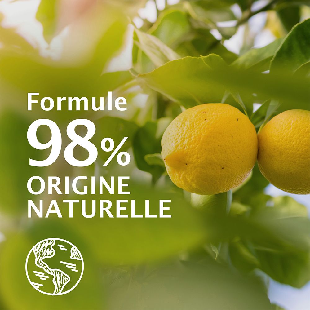 Zitronen und Blätter. Aufschrift: 98% natürliche Inhaltsstoffe. Weltkugel-Symbol.