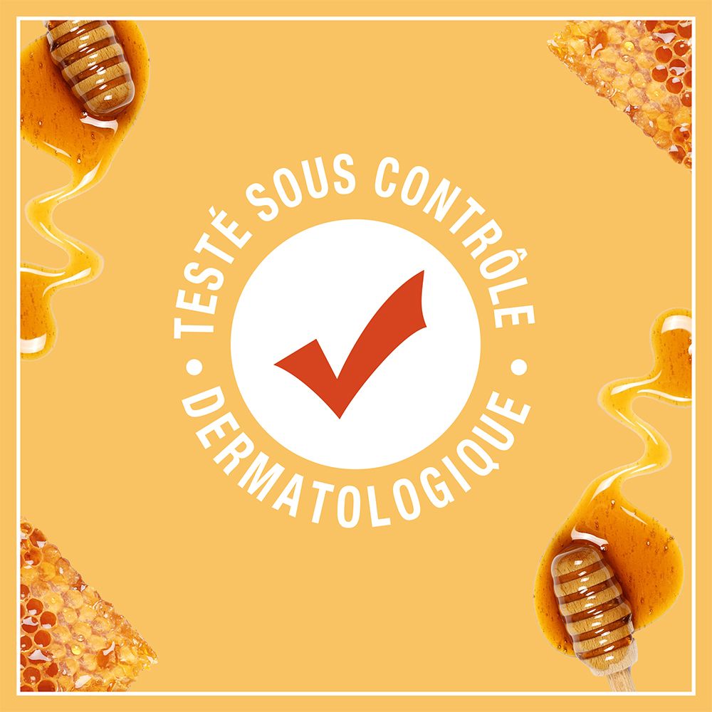Dermatologisch getest. Rotes Häkchen im Kreis. Text: Testé sous contrôle dermatologique.