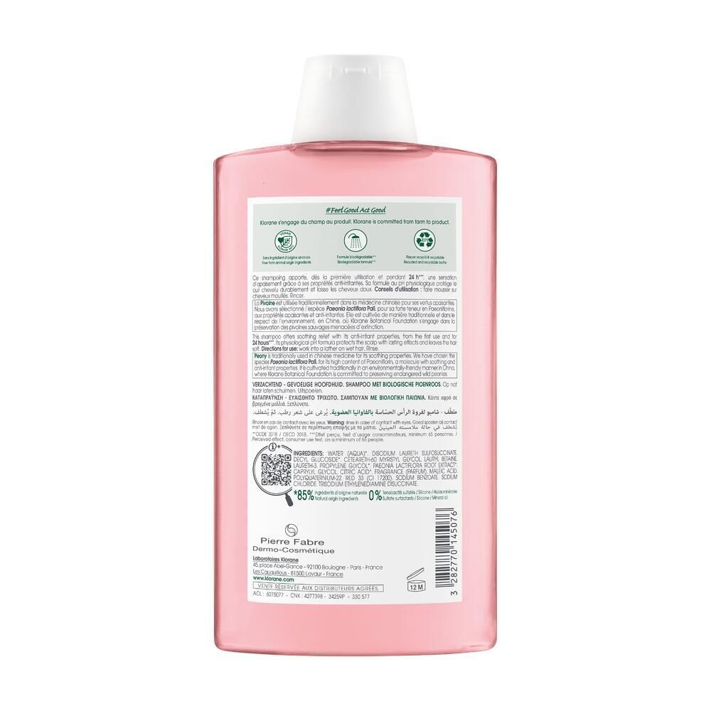 Dos du flacon rose. Texte: ingrédients, 85% ingrédients d'origine naturelle, flacon 100% recyclable.