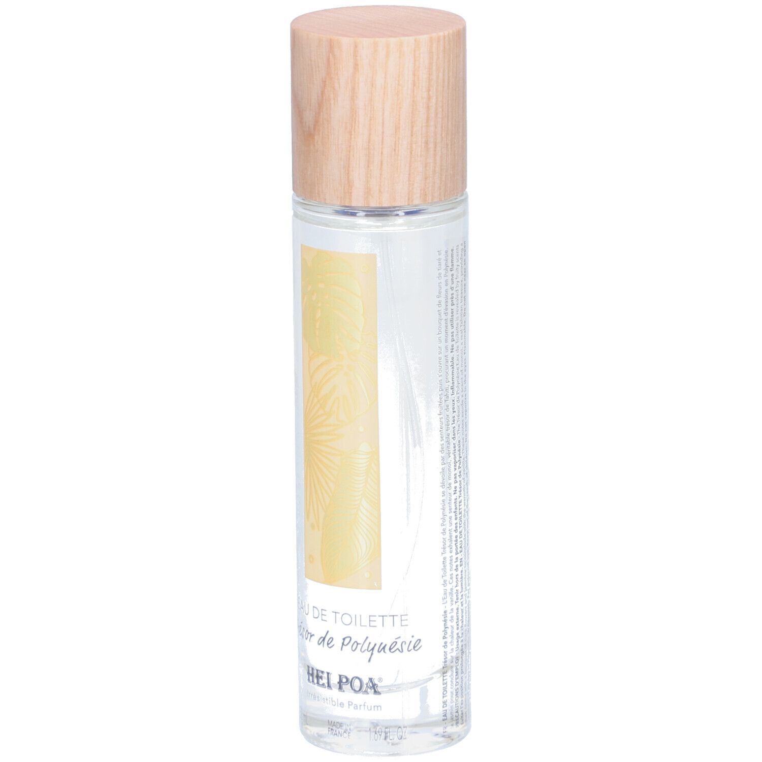Flacon cylindrique en verre avec bouchon en bois. Étiquette avec motif de feuille jaune et texte: EAU DE TOILETTE Trésor de Polynésie. Marque: HEI POA.