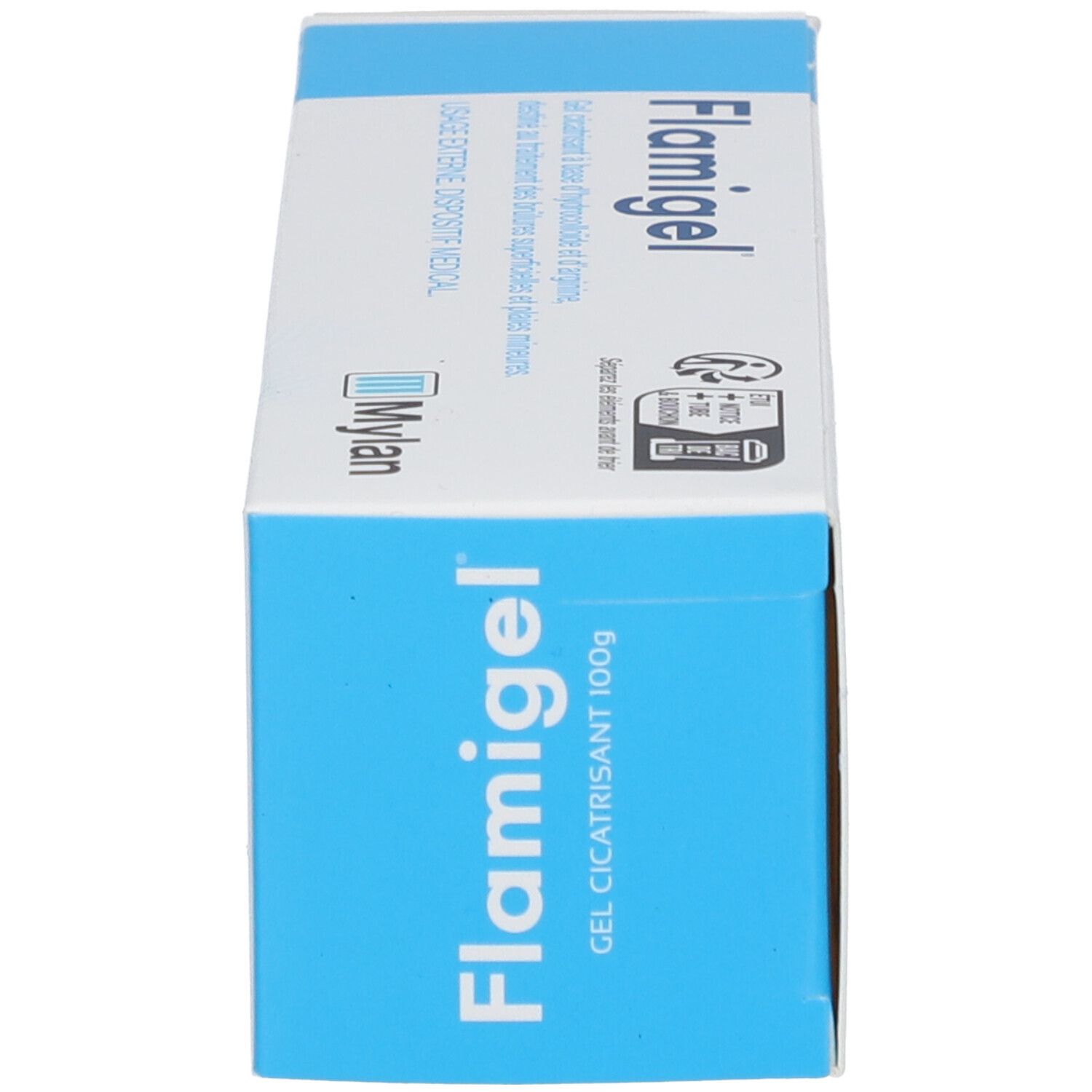 Emballage, vue latérale. Inscription Flamigel. Logo Mylan. Texte : Gel cicatrisant 100g. Couleurs bleu et blanc.