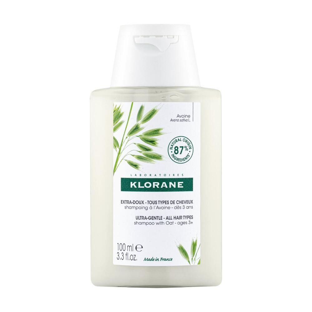Flacon de shampooing Klorane Hafermilch. Shampooing blanc avec étiquette verte. Contient 87% d'ingrédients d'origine naturelle.