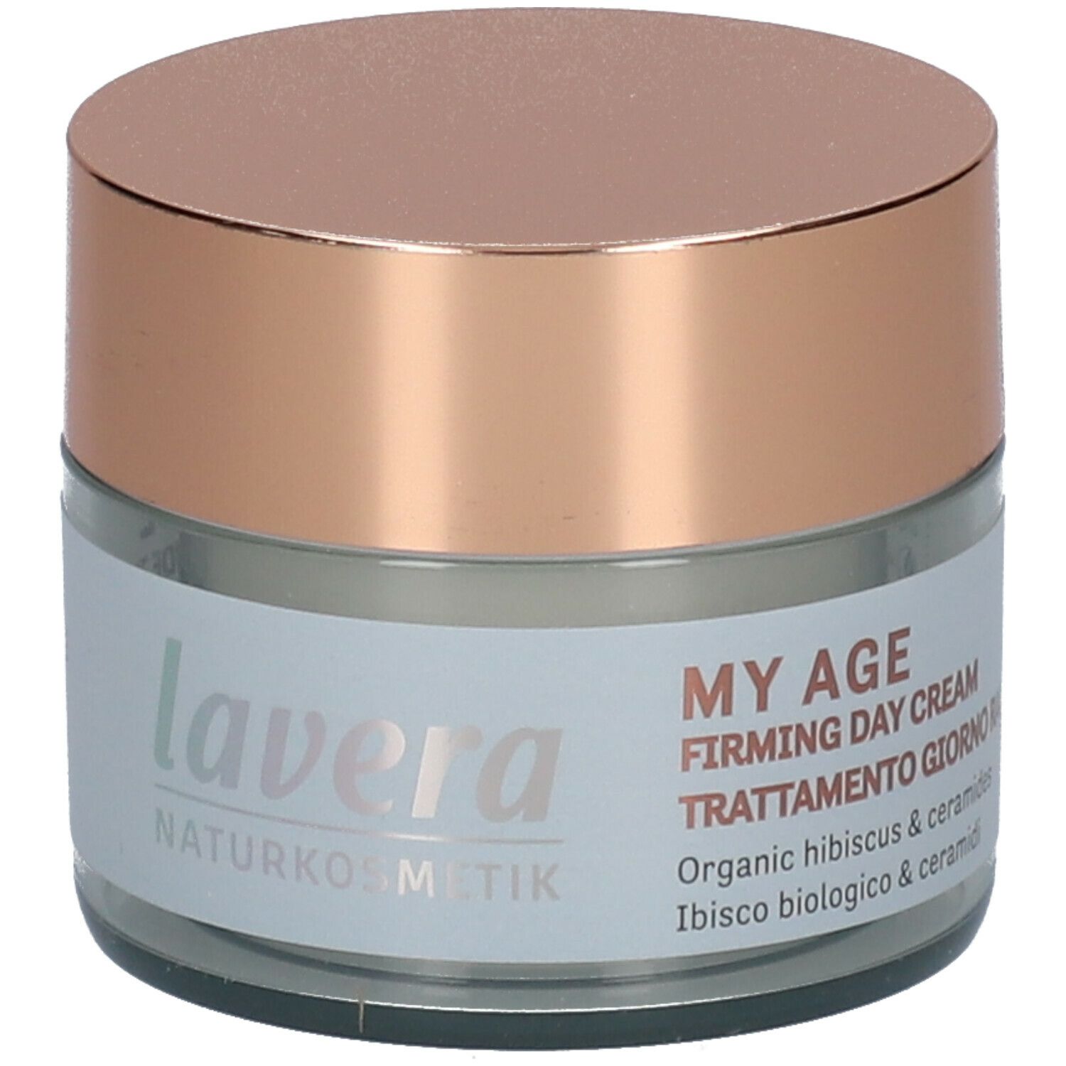Pot en verre avec couvercle rose. Inscription: MY AGE, Firming Day Cream, Trattamento giorno rassodante. Avec ingrédients.