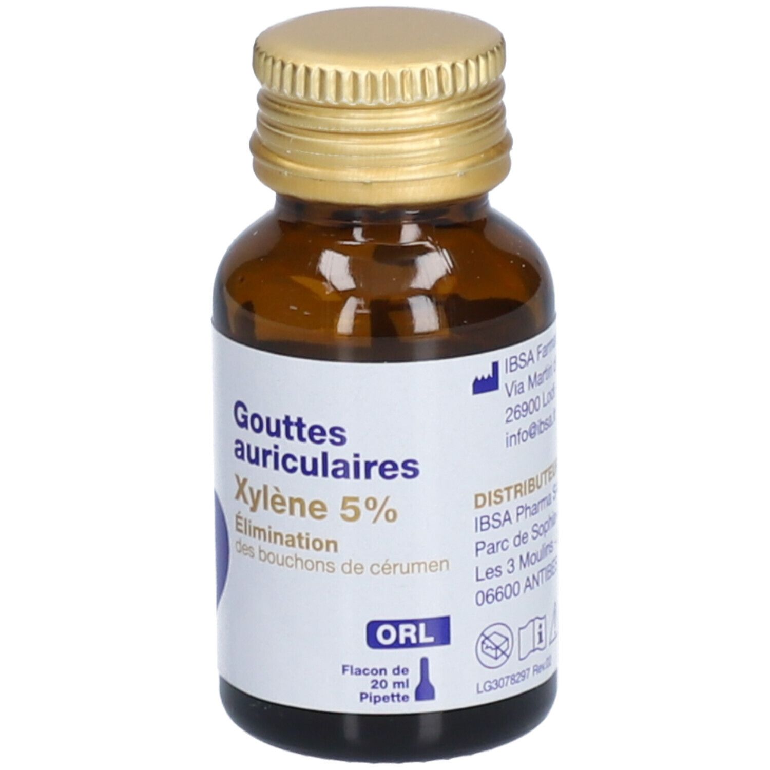 Flacon brun avec bouchon doré. Étiquette: Gouttes auriculaires Xylène 5%. Flacon 20 ml avec pipette.