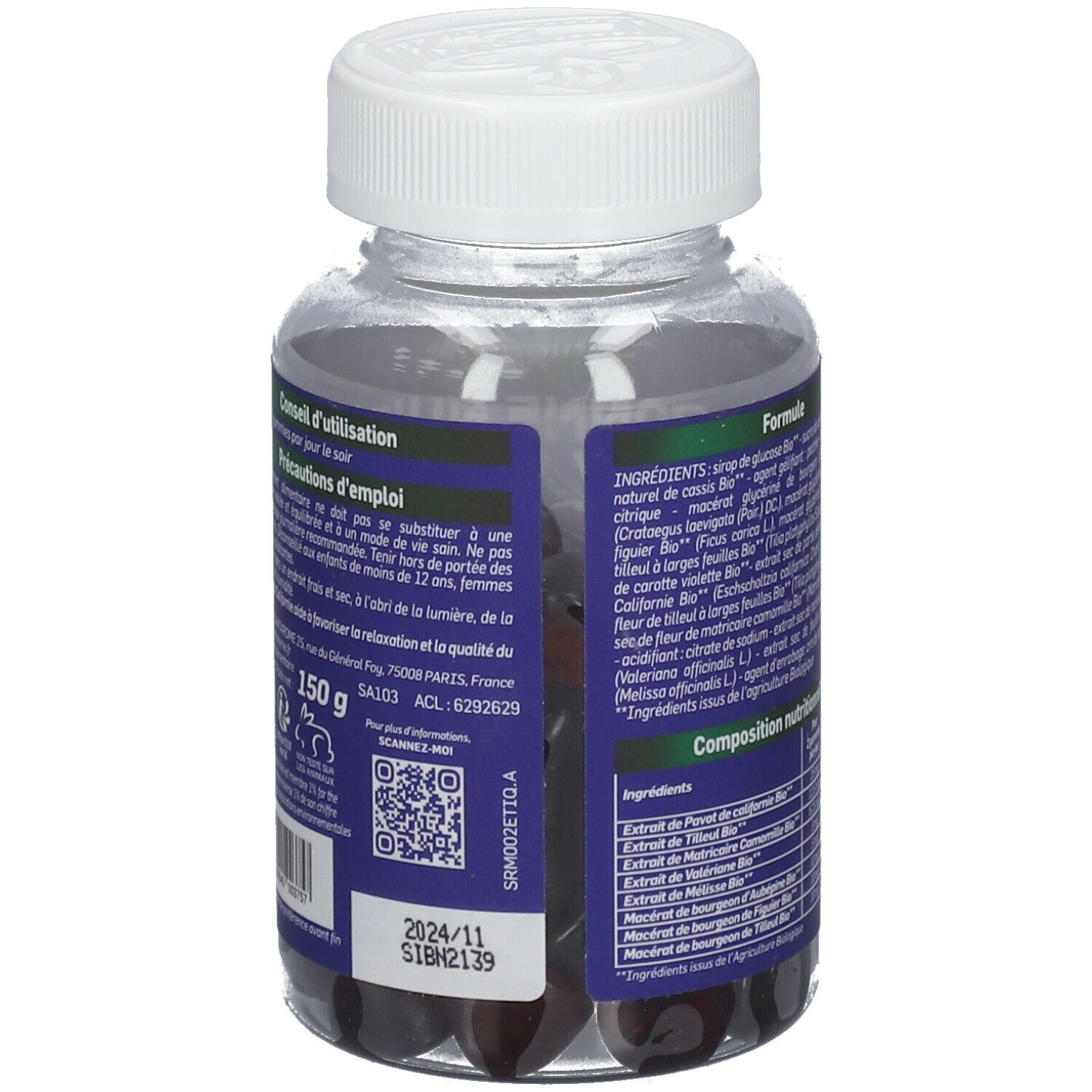 Flacon transparent avec gommes noires. Étiquettes bleues avec ingrédients, poids et date de péremption. Bouchon à vis blanc.