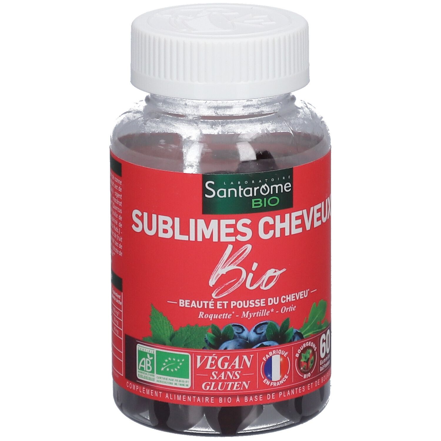 Flacon transparent de gummies noirs. Étiquette rouge avec nom du produit et label Bio. Vegan, sans gluten.