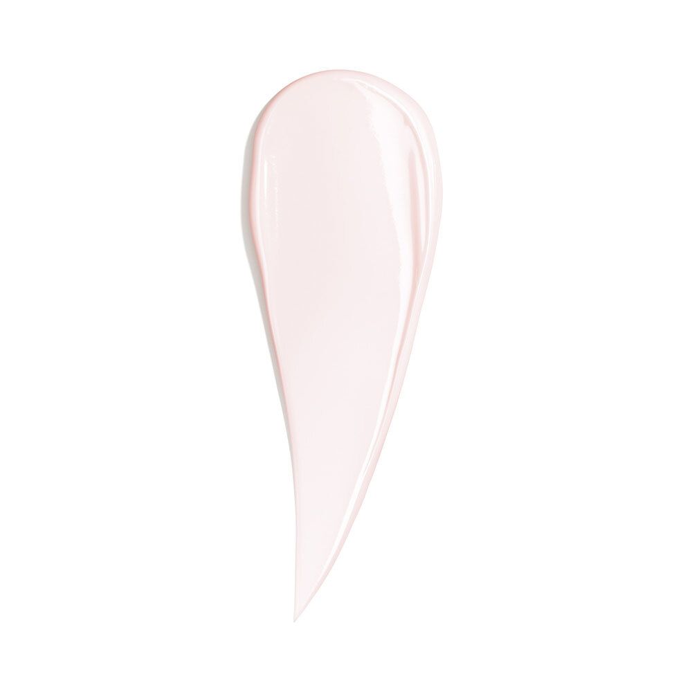 Fil de crème rose sur fond blanc. Forme d'une goutte.