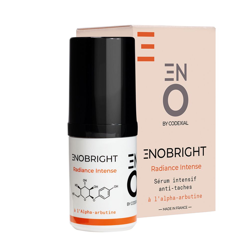 Flacon et emballage de sérum. Inscription: ENO Enobright Radiance Intense, Sérum intensif anti-taches. Avec alpha-arbutine.