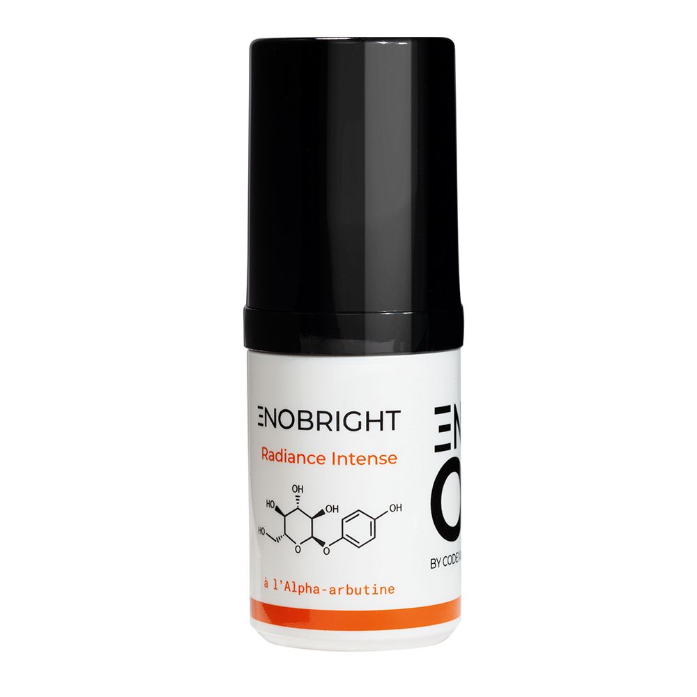 Flacon de sérum avec bouchon noir. Inscription: ENO Enobright Radiance Intense, Sérum intensif anti-taches. Avec alpha-arbutine.
