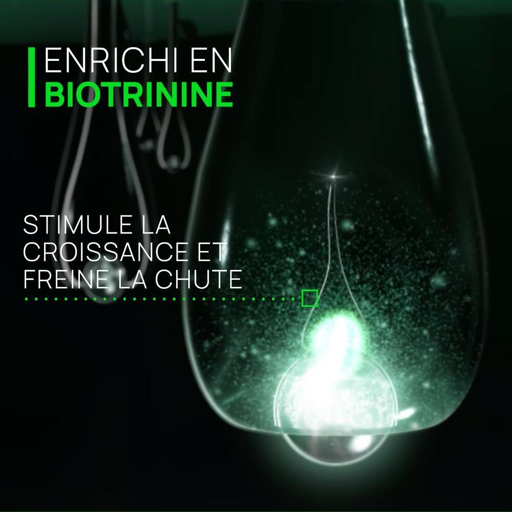 Goutte avec texte: Enrichi en Biotrinine, Stimule la croissance et freine la chute.
