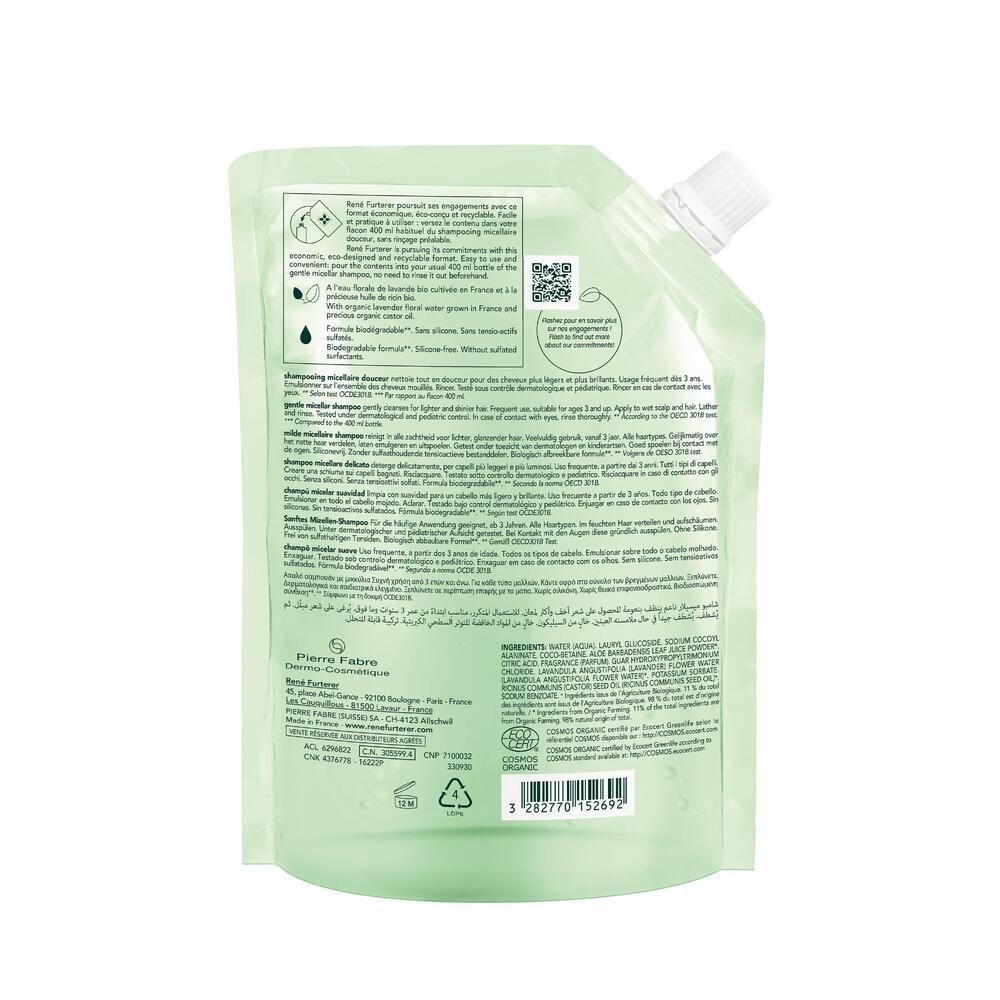 Dos de la recharge de shampooing. Texte et logos sur fond transparent. Contient des informations sur le produit et la marque.