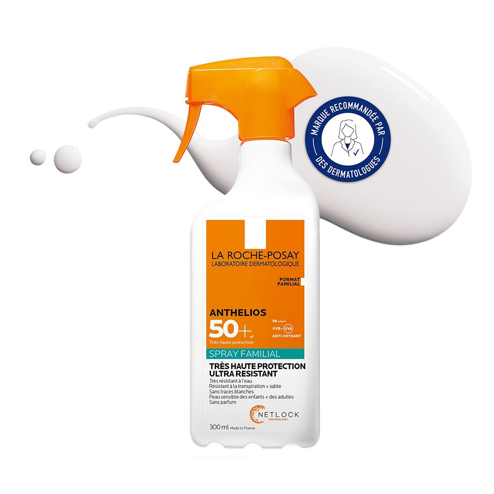Spray blanc avec tête orange. Inscription: ANTHELIOS 50+ SPRAY FAMILIAL. Recommandé par les dermatologues.