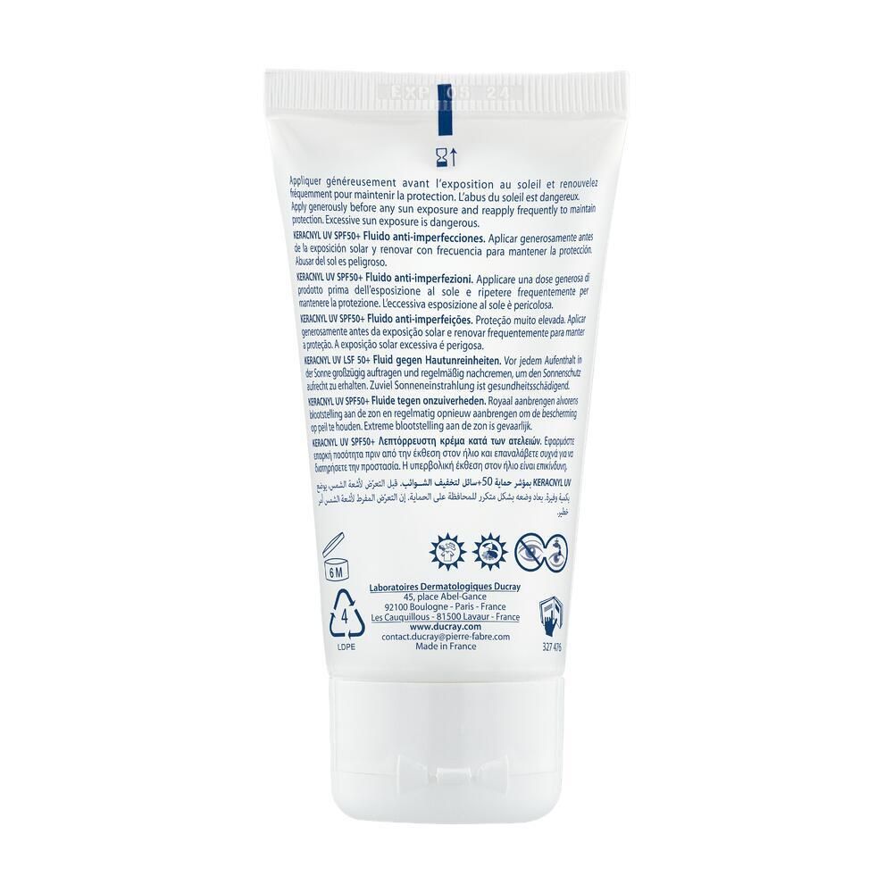 Dos du tube blanc. Texte multilingue. Informations d'utilisation et ingrédients. Symboles de recyclage.