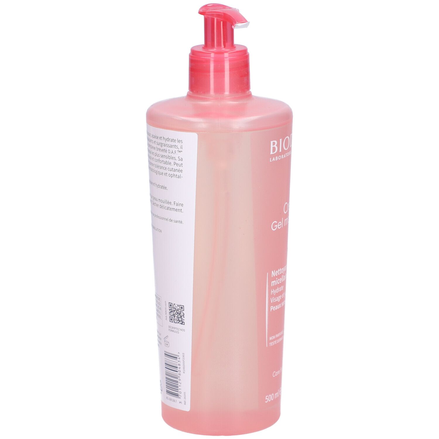 Dos du flacon rose avec pompe. Texte et code QR sur étiquette blanche. Informations produit.