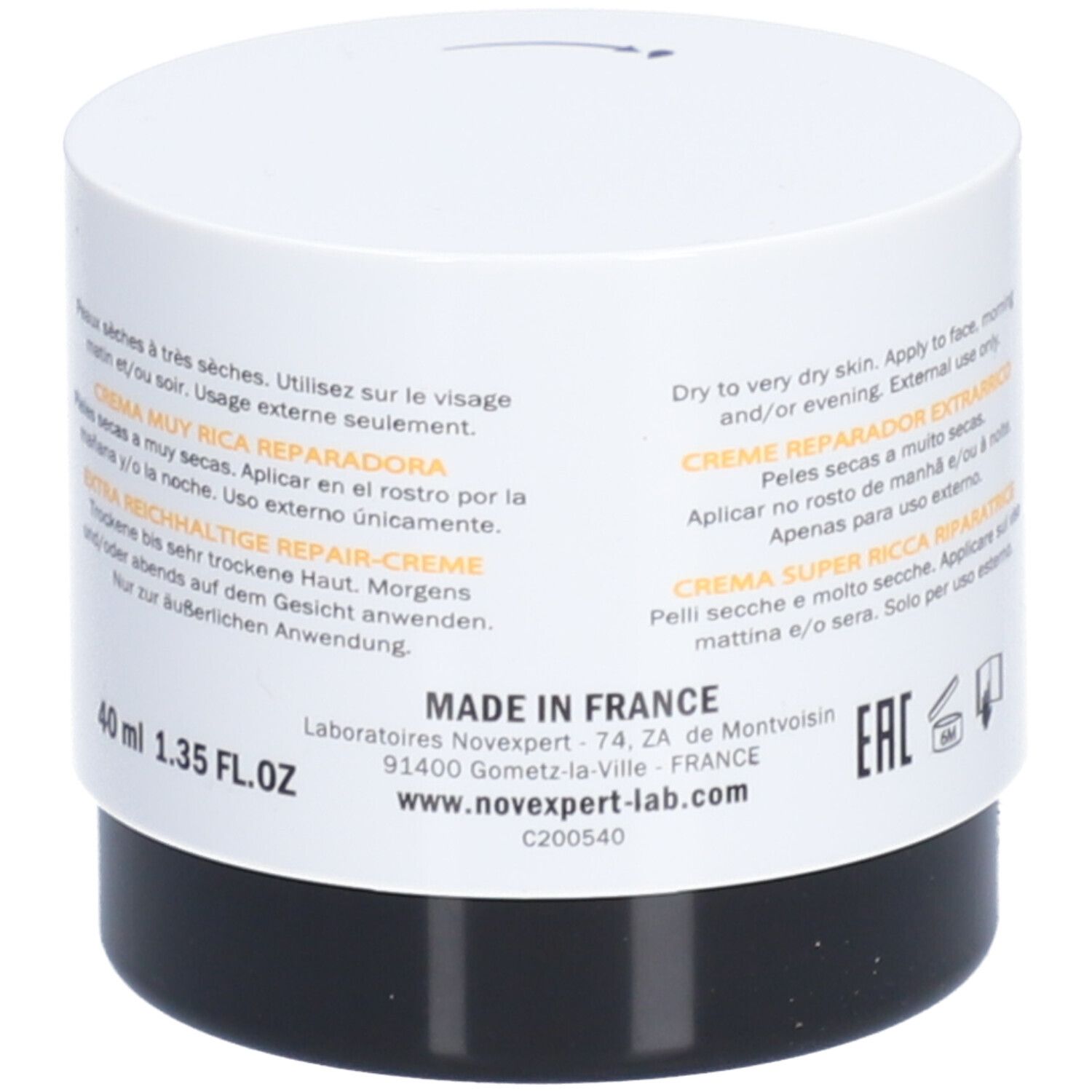 Pot de crème blanc et noir. Texte multilingue. Bande jaune. Fabriqué en France. 40 ml.
