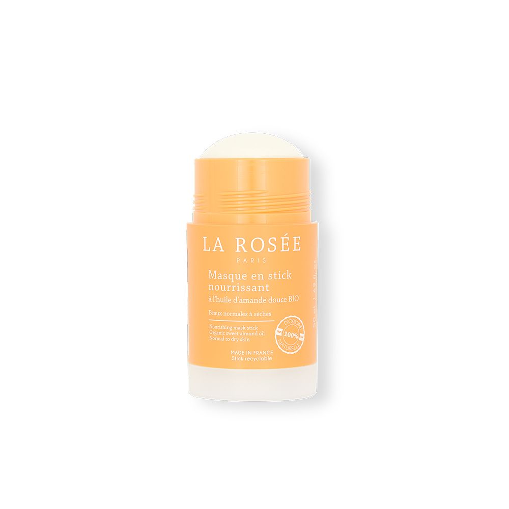 Masque en stick avec couvercle orange et base blanche. Inscription: La Rosée, Masque en stick nourrissant. Produit visible.