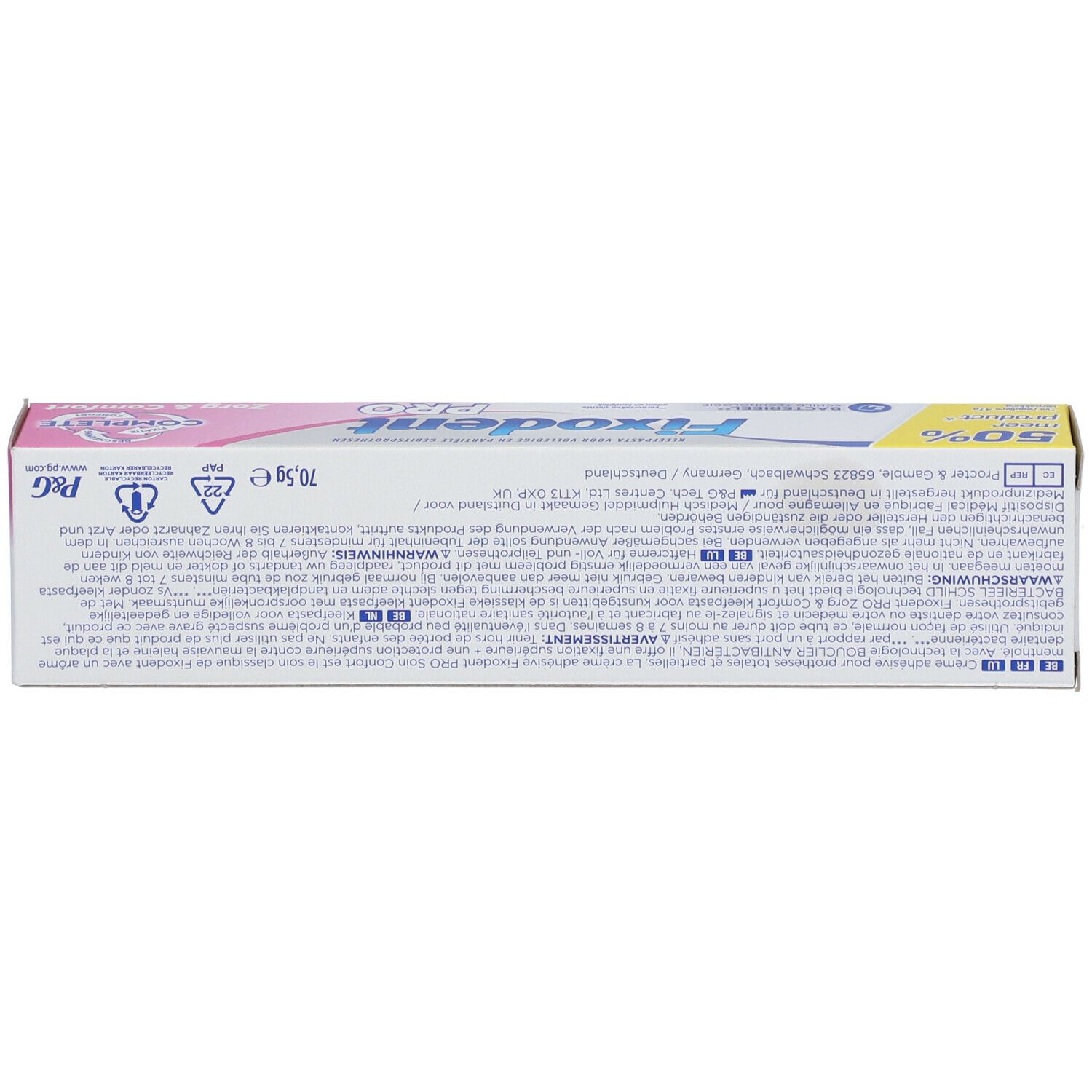 Dos de la boîte Fixodent Pro Complete. Texte multilingue. Rose et blanc.
