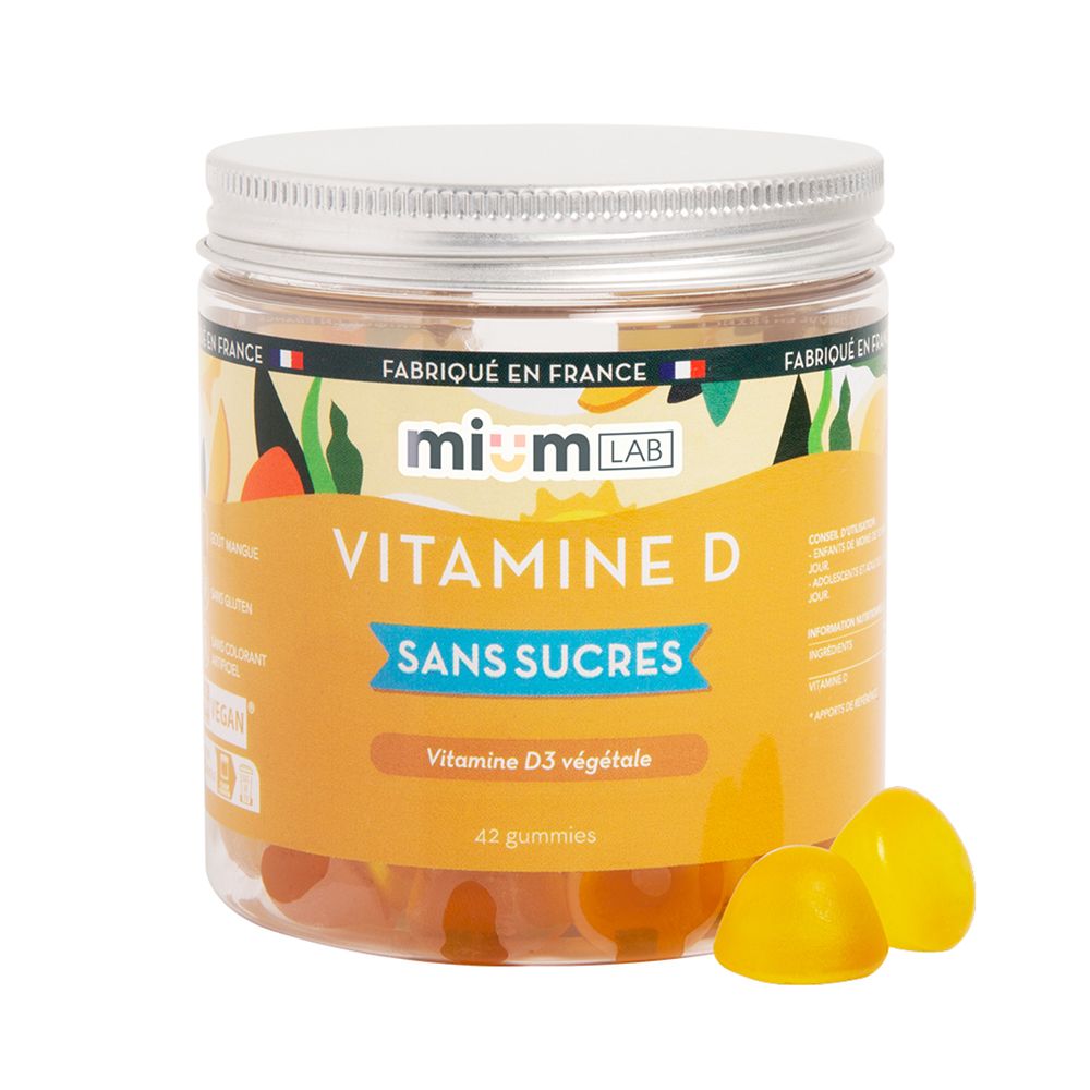 Pot de gummies à la vitamine D. Deux gummies jaunes à côté. Inscription : Vitamine D, sans sucres.