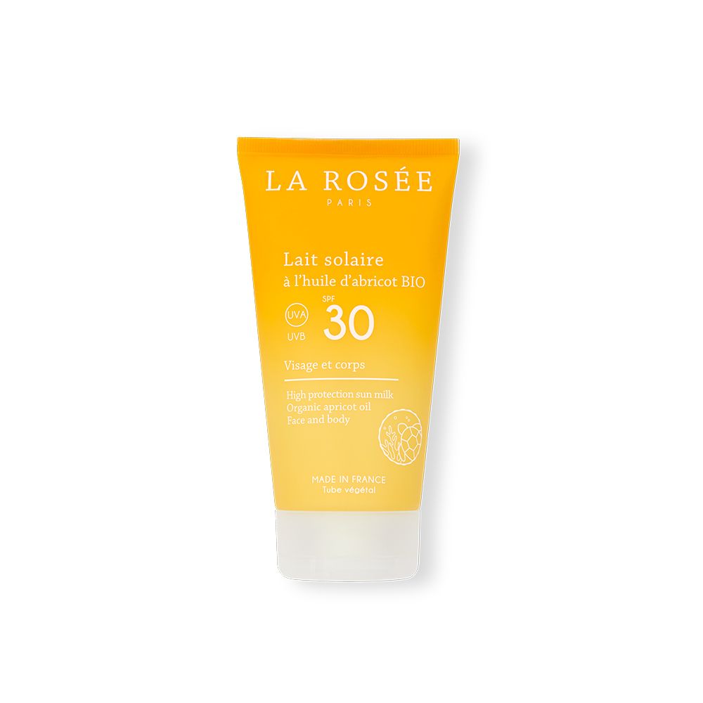 Tube jaune "LA ROSÉE" avec "Lait solaire SPF 30". Texte en français. Visage et corps.