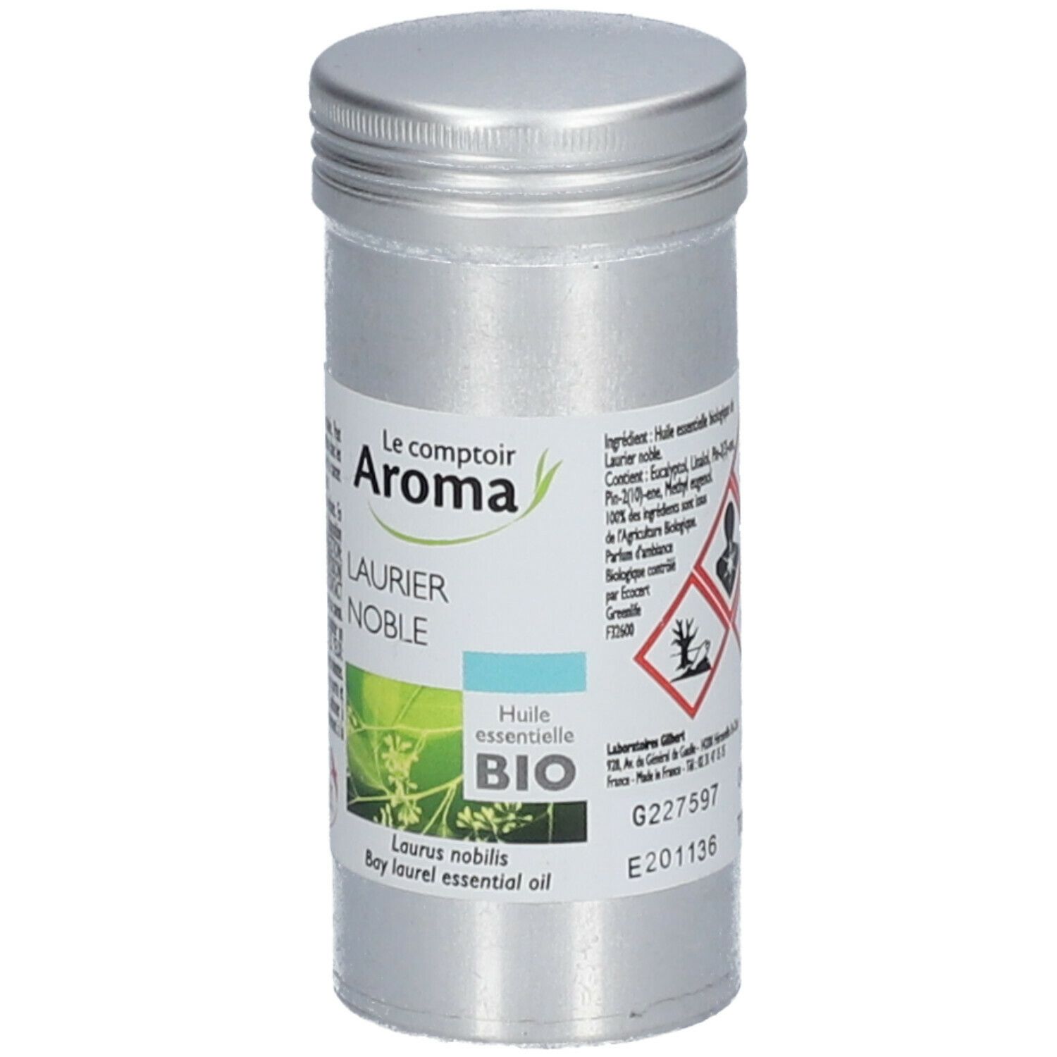 Flacon cylindrique en métal. Étiquette avec informations produit, symboles de danger et label Bio.